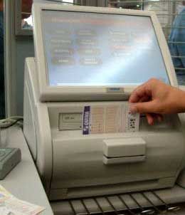 Industrial Monitor - South American Lotto Company Builds on ULTRA a hand putting a ticket into a cash register