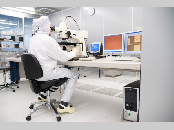 Touch Screen - Studies on children's handwriting on different touchscreen technologies a man in a white suit working on a microscope