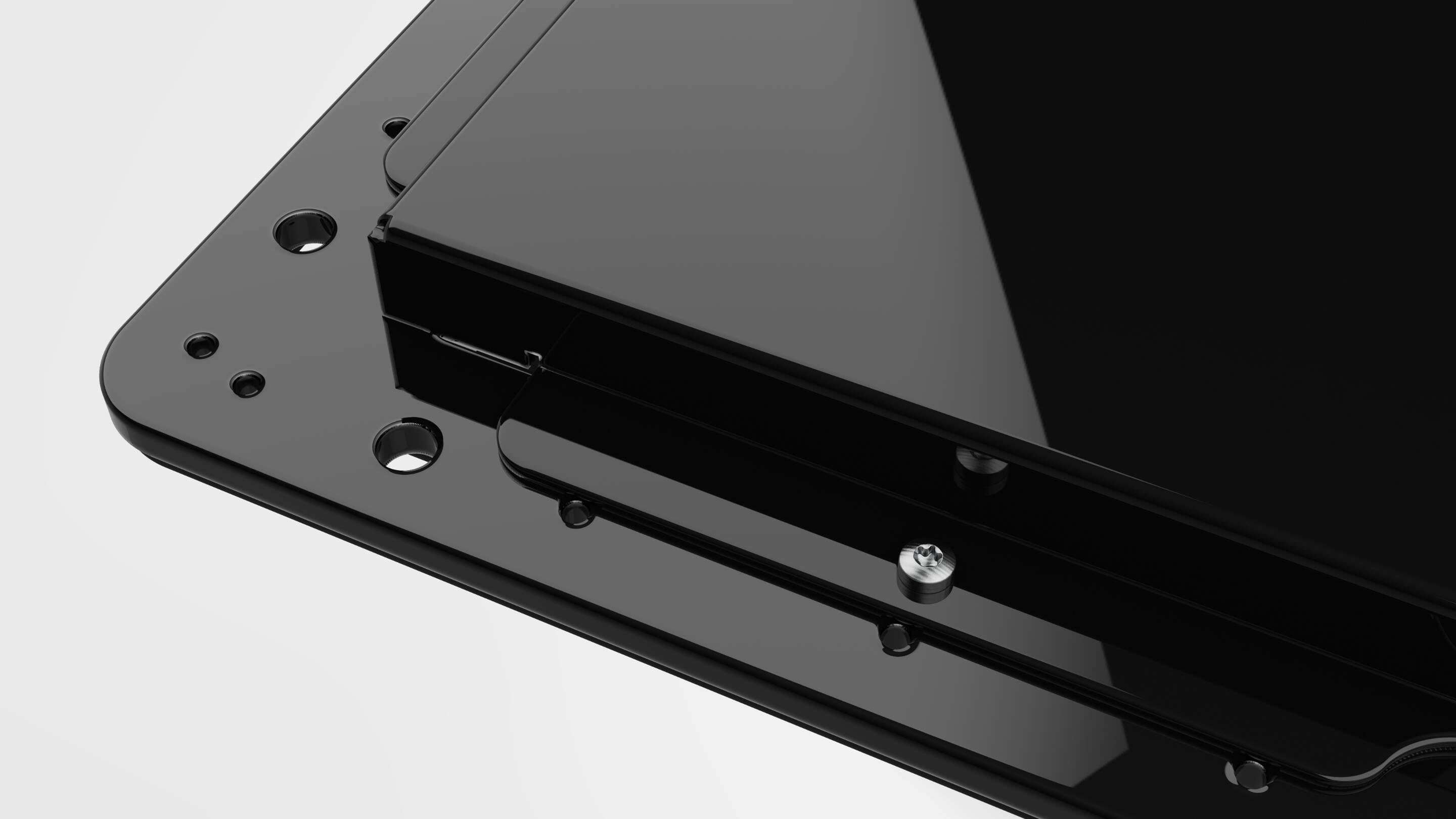 Vývoj - Open Frame Case Black Detail Čierny obdĺžnikový predmet so skrutkami